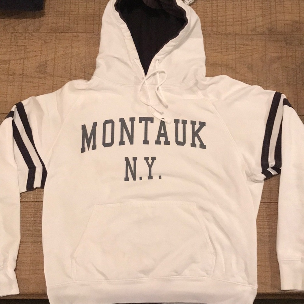 White hoodie sweatshirt with”montauk NY.” on chest